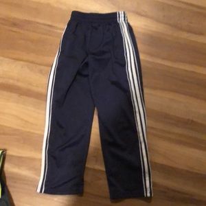 Boys size 7x track pants with side zippers on legs 3 inches in length.
